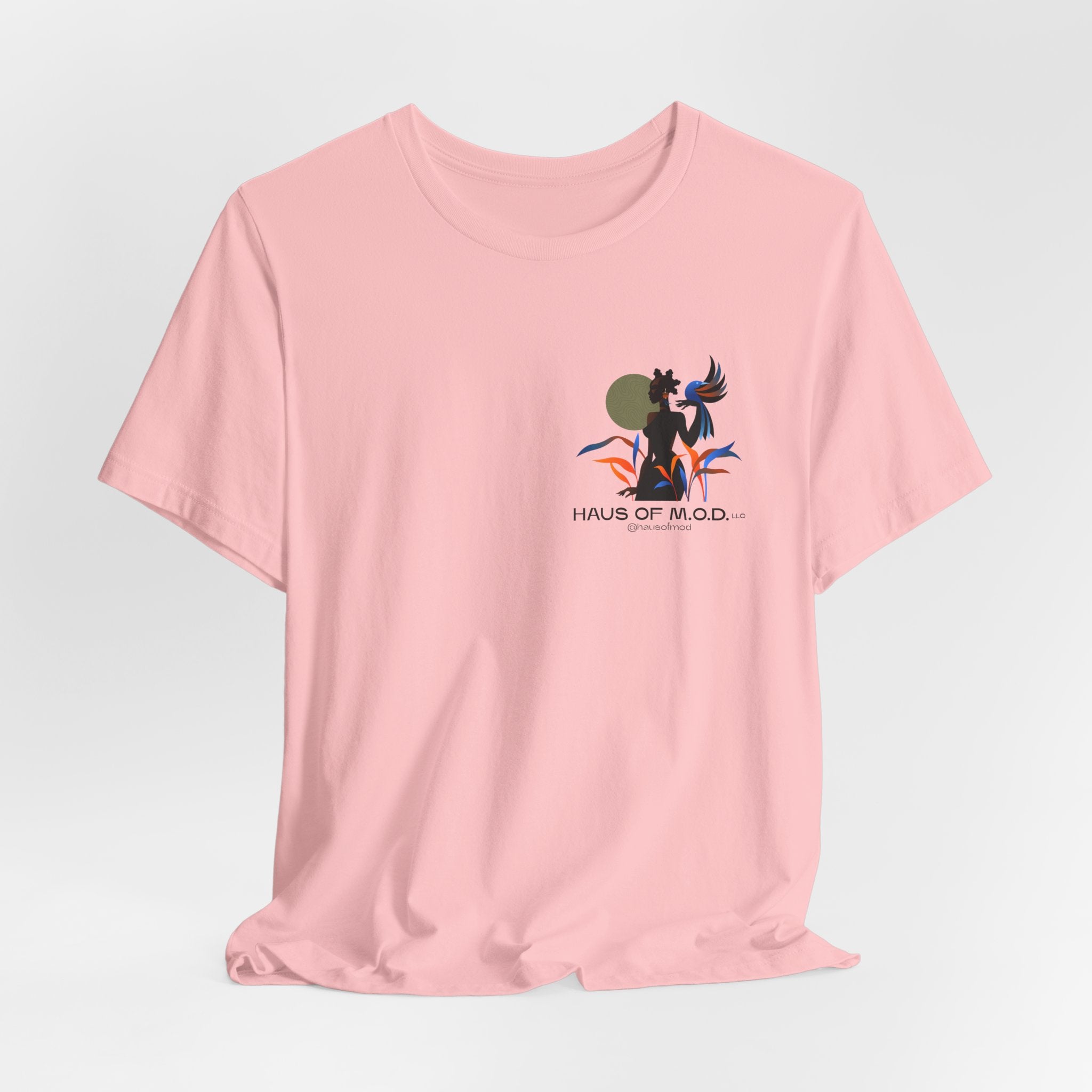 Pink t-shirt with a graphic design on a light gray background
