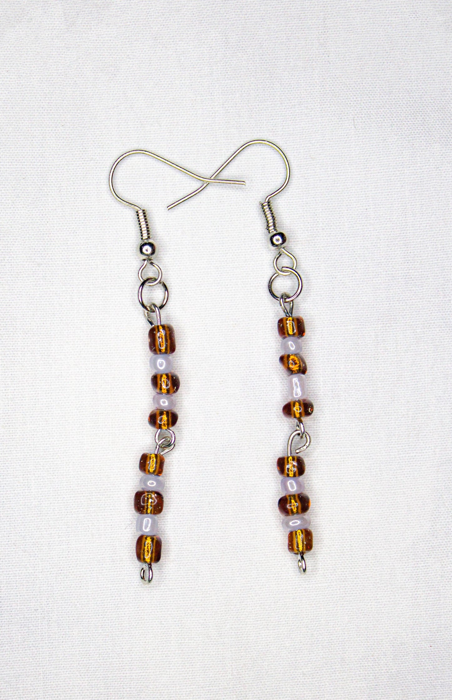 brown and white earrings