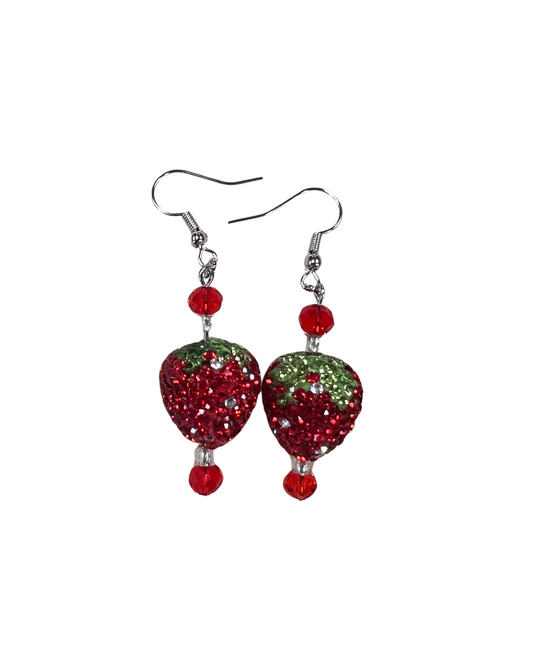 Strawberry-themed earrings with red and green gemstones on a white background
