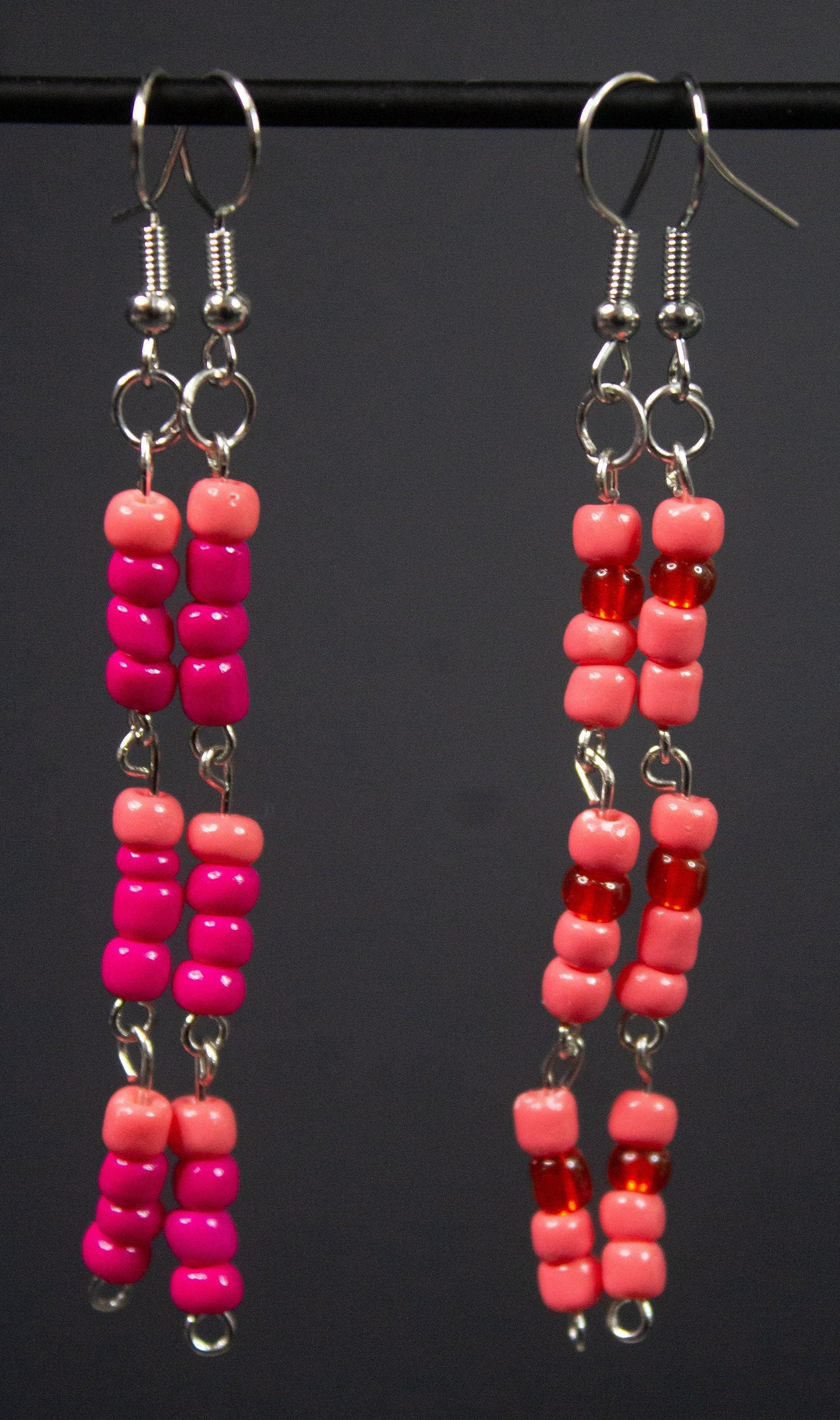 Earrings 1: more hot pink glass beads, one pastel bead, silver findings

Earrings 2: more pastel pink glass beads, one hot pink bead, silver findings